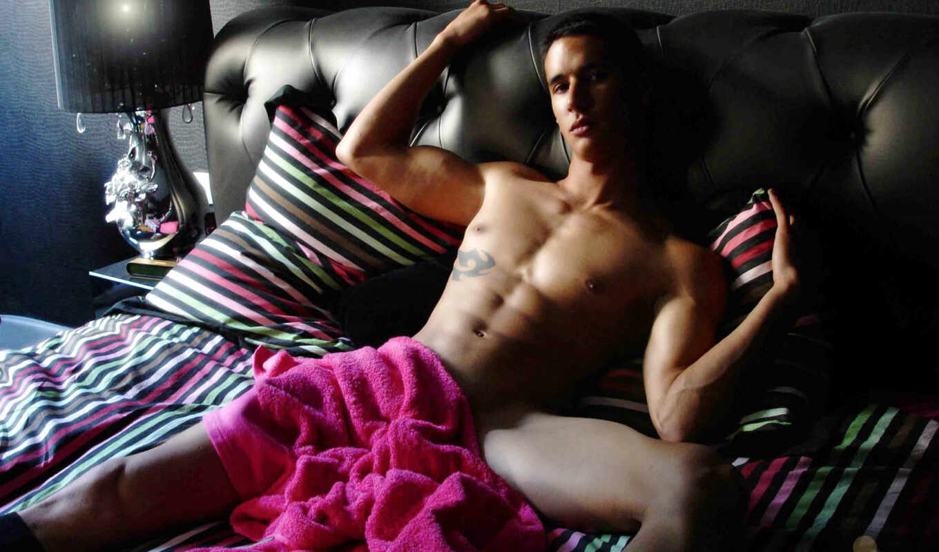 Sexy naked man on couch