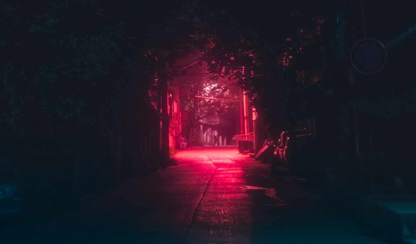 a laptop, light, red, night, dark, urban, lane, street