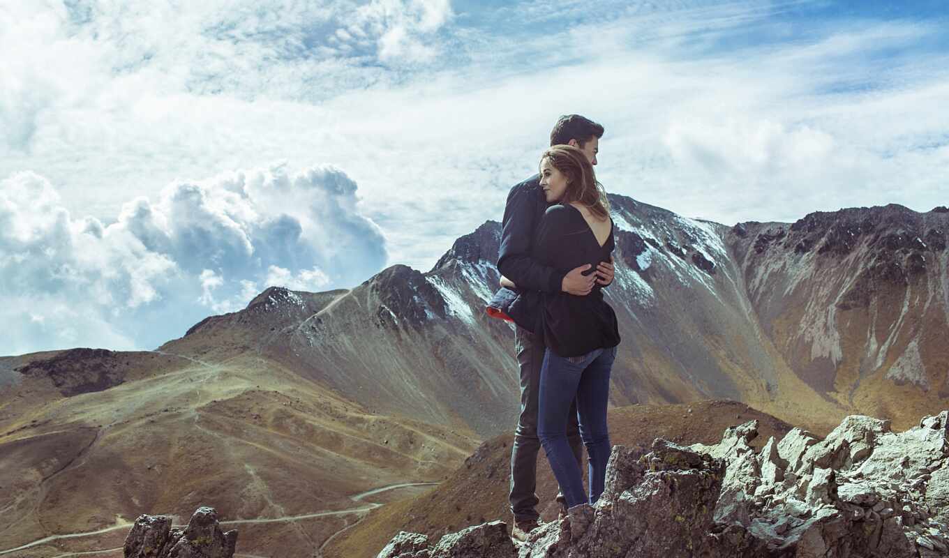 man, girl, woman, guy, are standing, hugging, top, mountains