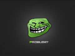 зеленое лицо тролля с черным фоном и белым текстом под ним