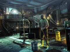 есть человек, стоящий в комнате с метлой