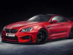 красное купе bmw m6, припаркованное в темной комнате