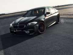 черный bmw m5 с оранжевыми ободками