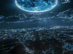 вид на город ночью с полной луной в небе