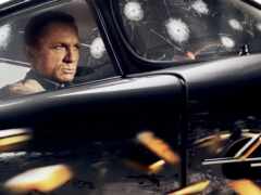 женское изображение мужчины в машине с пулевыми отверстиями в окне