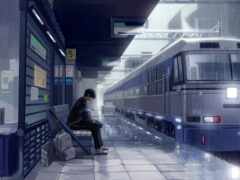 женщина сидит на скамейке в ожидании поезда