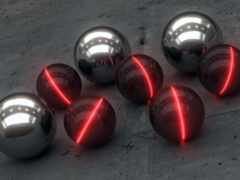 шесть блестящих сфер с красными огнями на бетонной поверхности