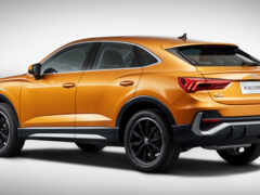 закрытие желтого внедорожника, припаркованного на серой поверхности