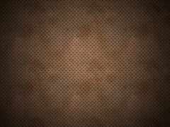 темно-коричневый фон с небольшими отверстиями и небольшим отверстием в середине