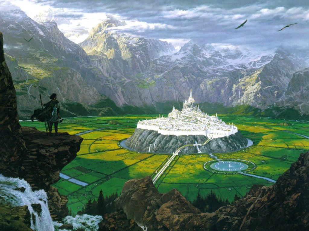 картина человека, стоящего на скале с видом на горный пейзаж