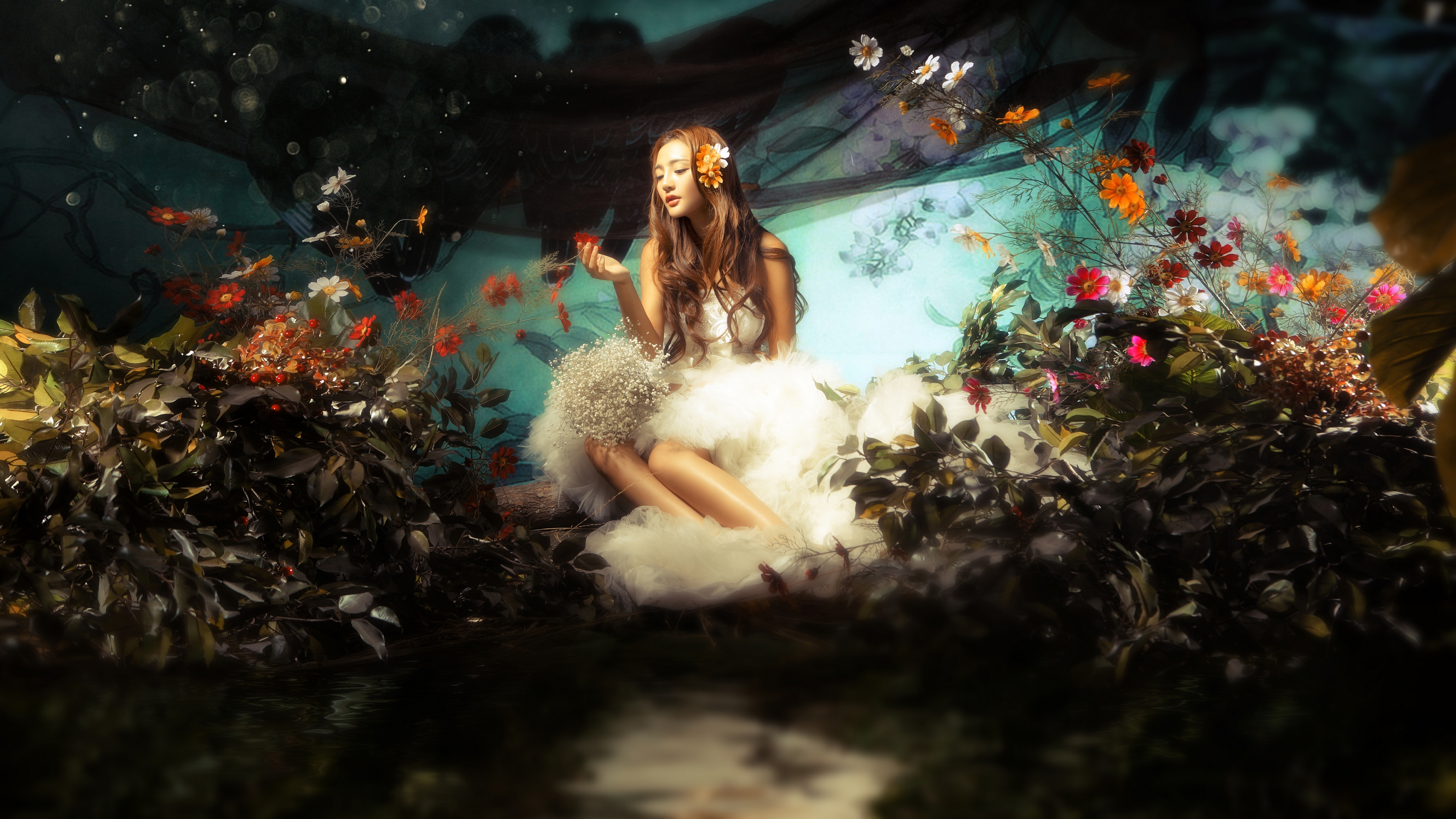 женщина сидит на скале в саду